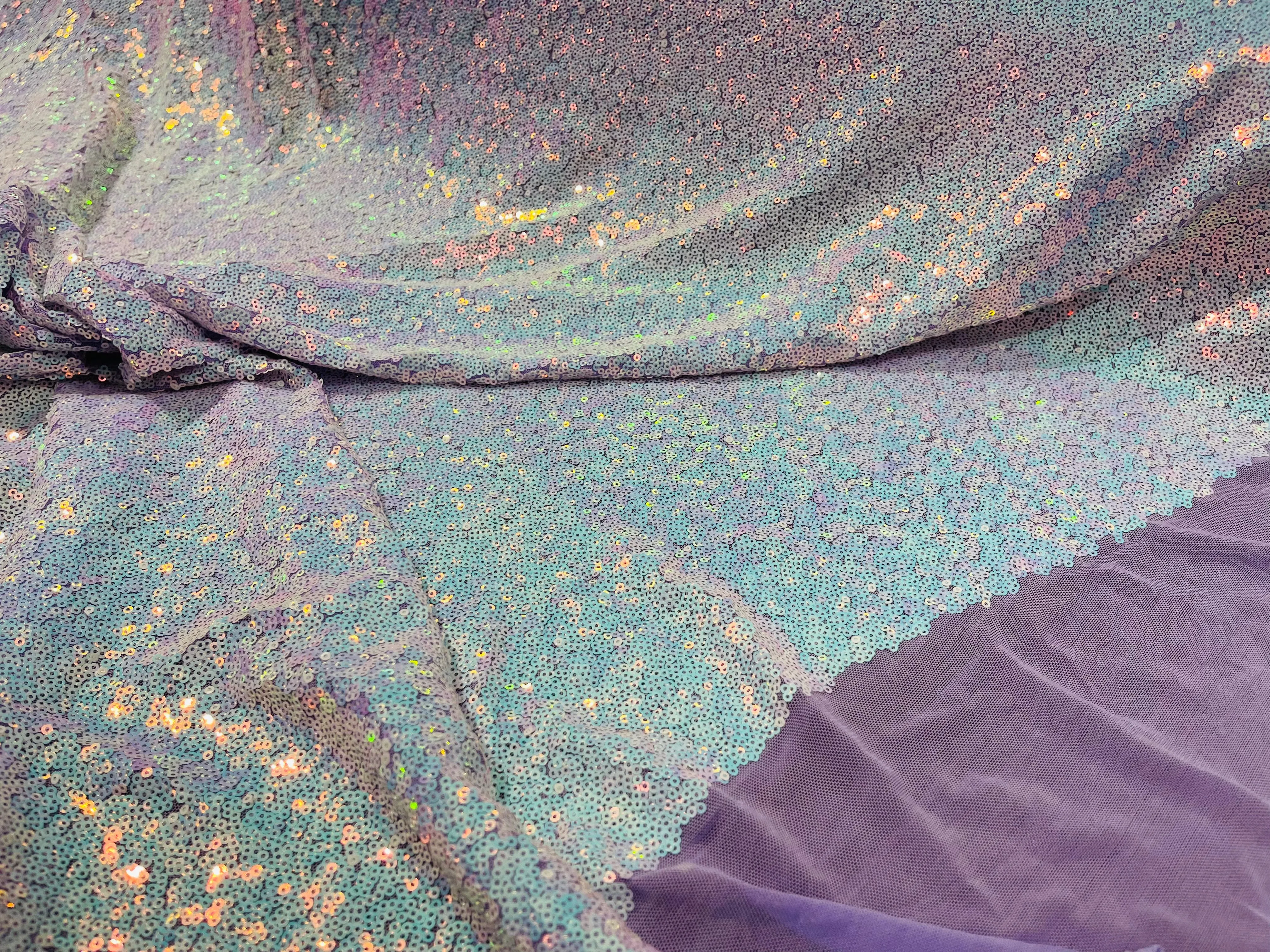 Aqua Iridescent Mini Glitz Sequins on a Lilac 4 Way Stretch Mesh-Sold By The Yard.