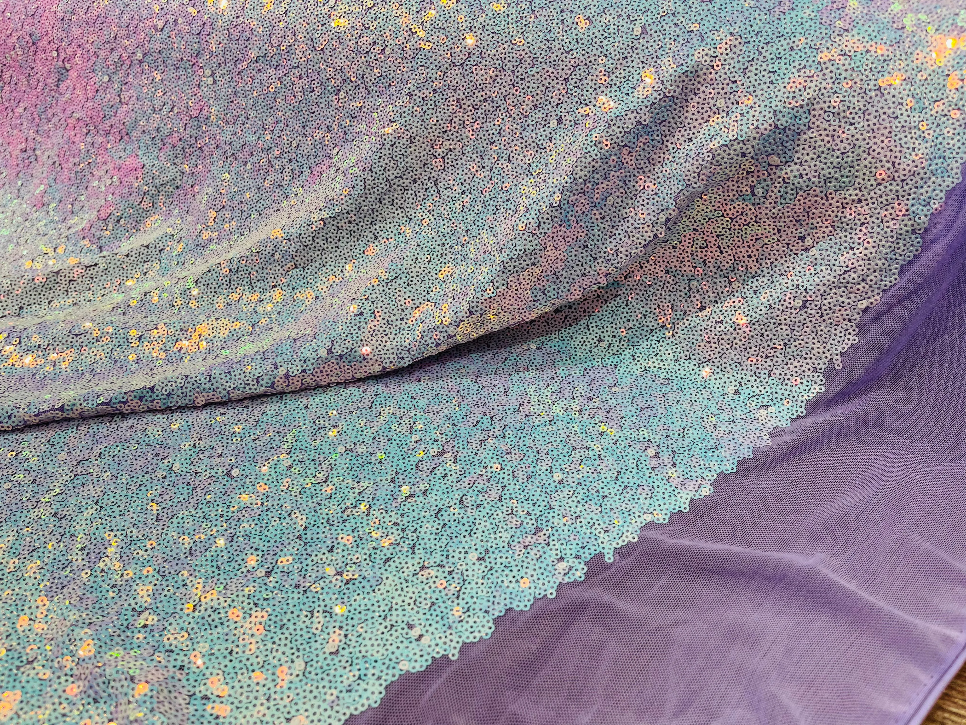 Aqua Iridescent Mini Glitz Sequins on a Lilac 4 Way Stretch Mesh-Sold By The Yard.