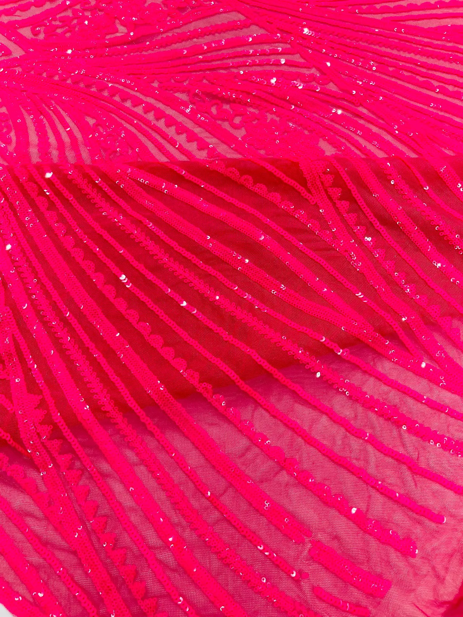 Geometric Feather wing shiny sequin design on a 4 way stretch mesh Fabric-old by the yard.