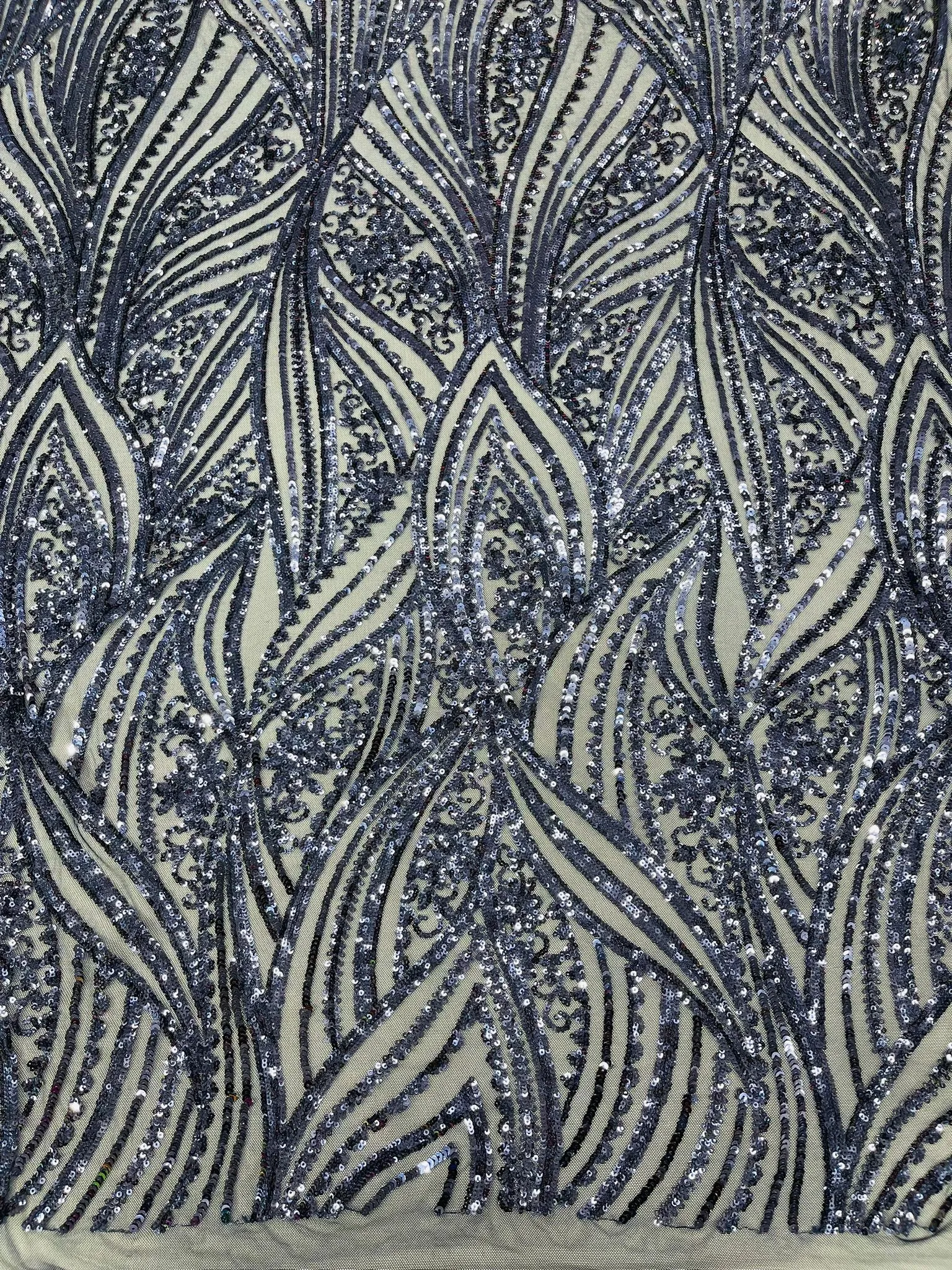 Geometric Feather wing shiny sequin design on a 4 way stretch mesh Fabric-old by the yard.
