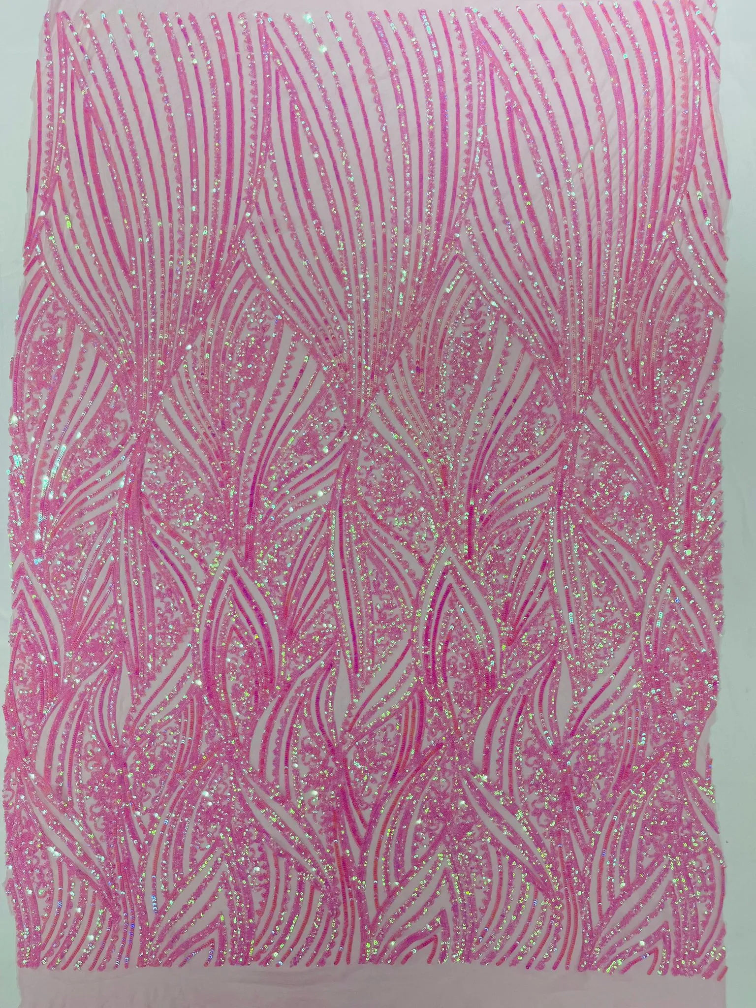 Geometric Feather wing shiny sequin design on a 4 way stretch mesh Fabric-old by the yard.