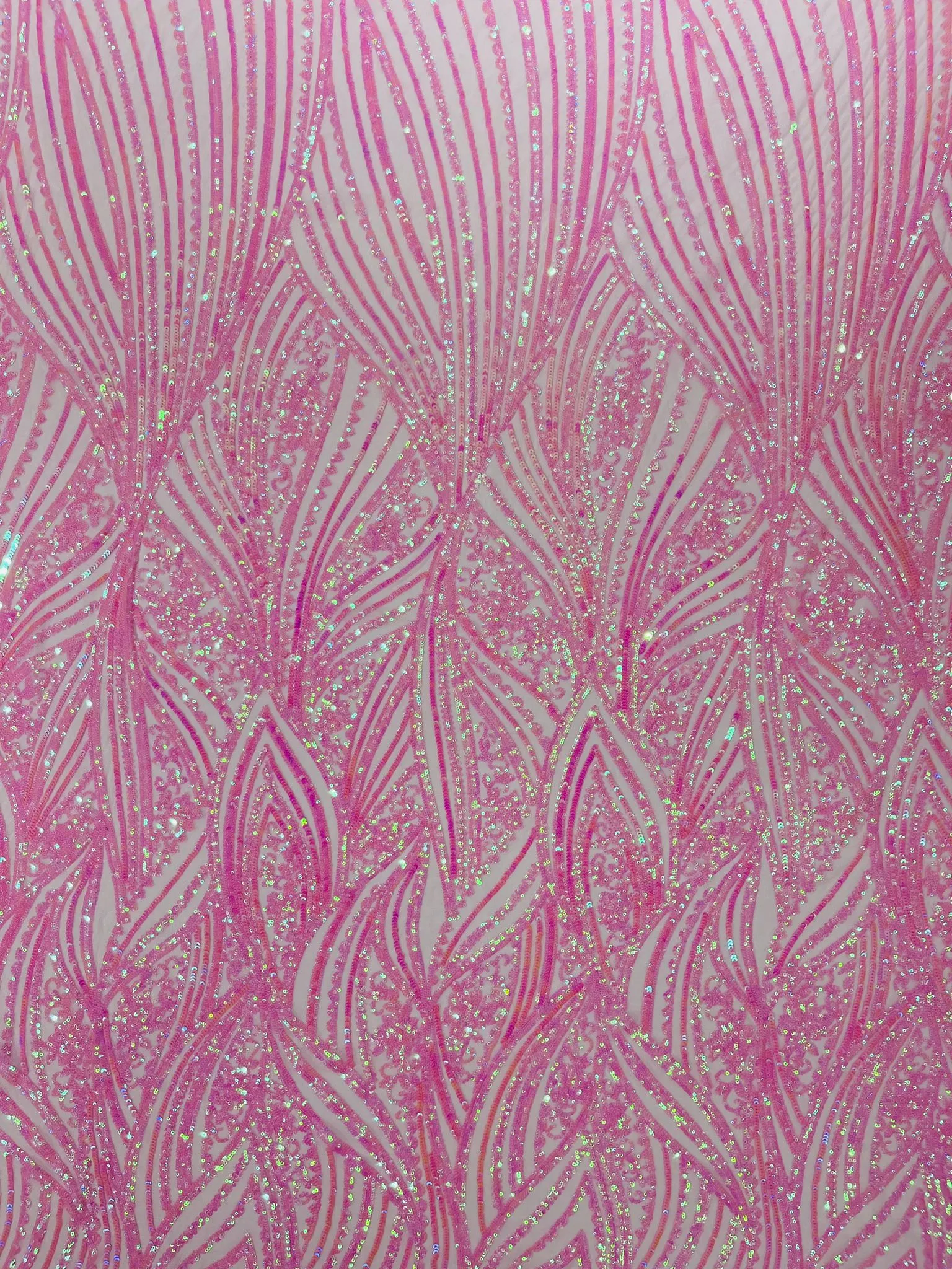 Geometric Feather wing shiny sequin design on a 4 way stretch mesh Fabric-old by the yard.