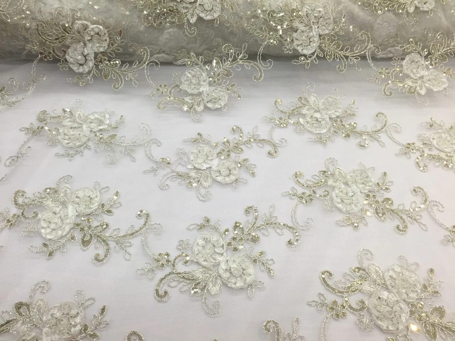 Ivory  3d flowers embroider with sequins on a mesh lace fabric. Sold by the yard.