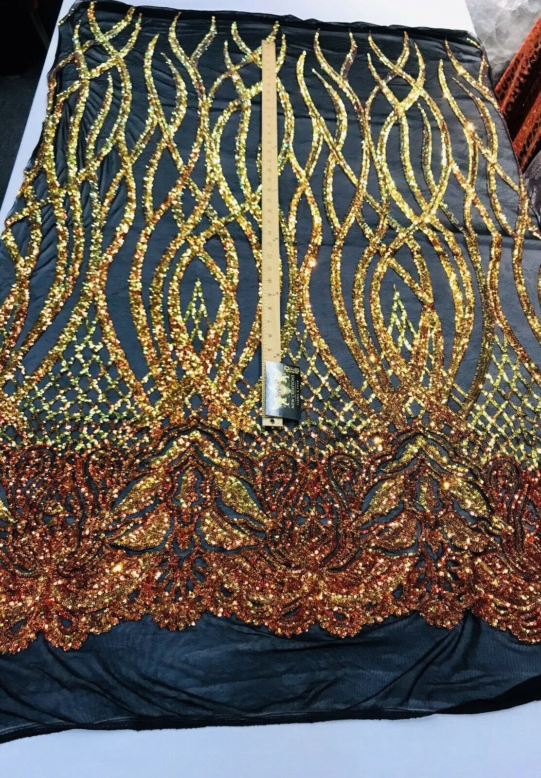 Orange iridescent phoenix flames sequin design on a 4 way stretch black mesh-prom-nightgown-sold by the yard-free shipping in the USA-